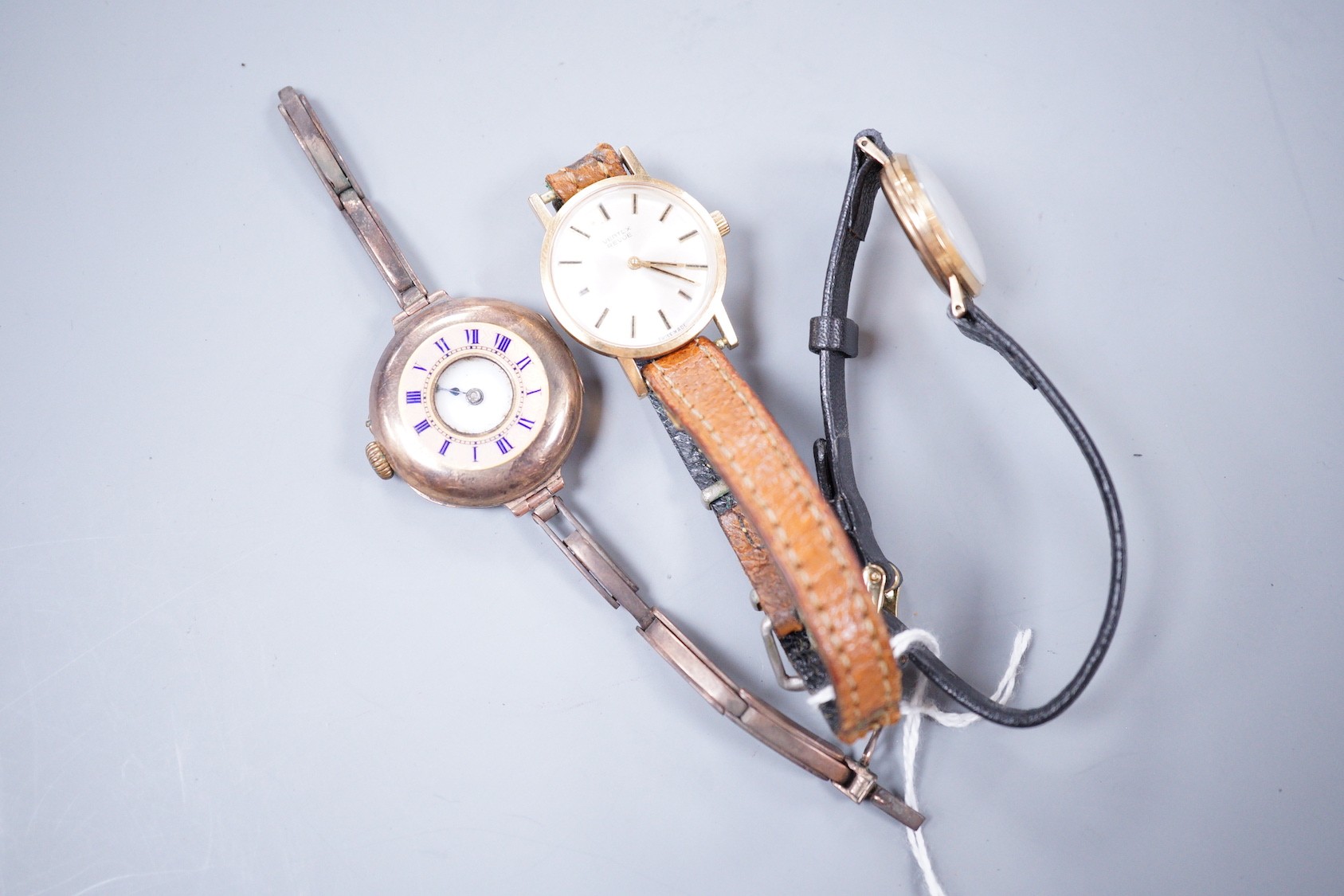 Three assorted lady's 9ct gold manual wind wrist watches, including a Vertex Revue and Rotary on leather straps and half hunter on damaged 9ct bracelet.